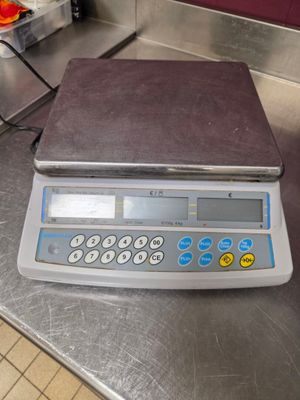 an image of a scale on a table in a kitchen