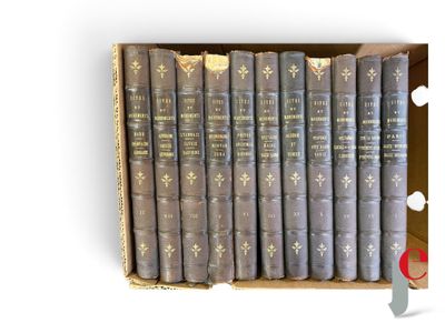 a box full of old books sitting on top of a table