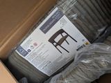 a cardboard box full of chairs and a chair in it