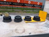 three different types of water pumps on a cement surface