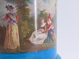 a blue vase with a picture of a woman on it