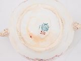 a white plate with a blue and red design on it