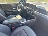 the interior of a car with black leather seats and a steering wheel