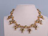 an image of a gold necklace on a mannequin mannequin mannequin mannequin mannequin mannequin mannequin mannequin