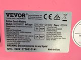 a close up of a pink refrigerator with a sticker on it