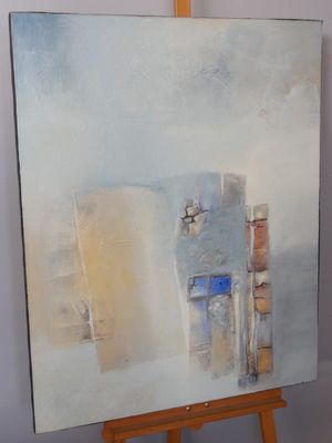a painting that is on a easel in a room