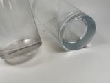two empty glasses sitting next to each other on a table