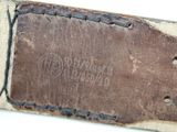 an old leather belt with a metal buckle on a white surface