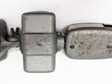 a close up of a metal object on a white surface