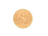 a gold coin with a picture of a rooster on it