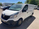 a white van parked in a parking lot with other cars in the background