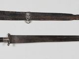 two knives that are laying next to each other on a table