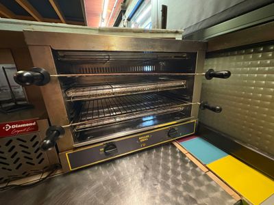 a toaster oven that is sitting in a kitchen