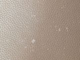 a close up view of a white leather surface