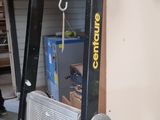 a ladder that is leaning against a wall in a garage