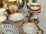 many different types of vases and bowls on the table