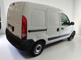 a white van that is parked in a white room