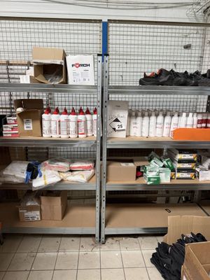 many boxes and boxes on the shelves in the garage