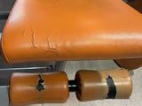 a chair that has two wheels attached to the back of it