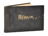 an old book with the word album written in gold on it