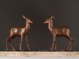 pair of bronze deer sculptures on marble base