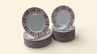 many plates stacked on top of each other on a table