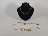 an assortment of jewelry including a necklace, bracelet, and ring