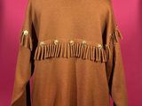 an image of a brown jacket with fringes on a mannequin