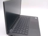 a laptop with a black keyboard on a white surface