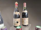 several bottles of wine are on display in a glass case