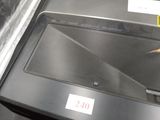 a laptop computer sitting on top of a black table