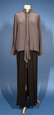 an image of a mannequin wearing a gray shirt and black pants