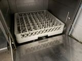 a dirty dishwasher with a rack in it