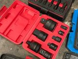 many different tools in the case on the floor