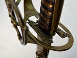 a close up of a sword on a stand