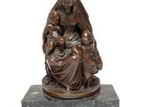 an image of a statue of a woman holding a child