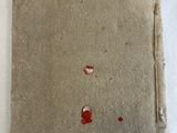 a small piece of paper that has been left on the bed