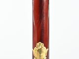 an image of a red and gold pipe with a heart on it