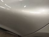 a close up of a car ' s front bumper and fender