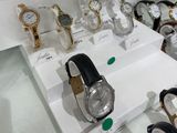 many different watches on display in a glass case