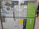 a large metal cart with a lot of items in it