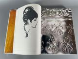 an open book with a picture of a woman on it