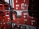 boxes of beer are stacked on a shelf in a room