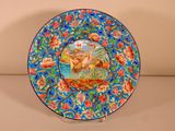 a colorful plate with a picture of a man and a dog on it