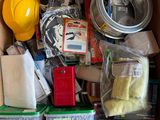 a cardboard box filled with assorted items on the floor