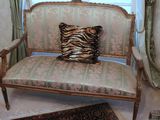 a zebra print pillow on a chair in a room