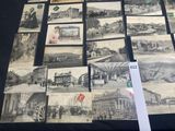 a lot of old black and white pictures on the table