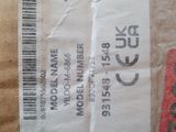 a brown paper bag with a red tag on it
