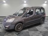a grey van that is parked in a room