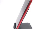 a cell phone that is sitting on a stand
